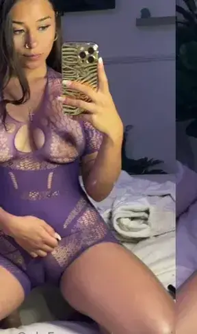 Mirror selfie in my sheer purple bodysuit on the sofa