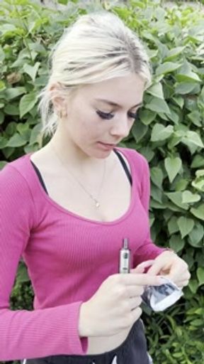 A smoker girl has a really bad cough and hocking and spitting phlegm and loogies