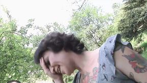 Tattooed brunette gets spitroasted at outdoor sex audition