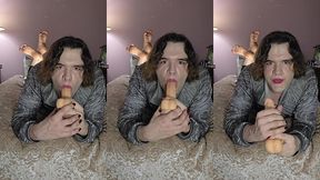 nonbinary femboy does some throat training while doing  the pose