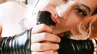 Inhaling on a giant black faux-cock