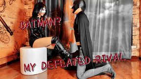 Batman kneeling at Catwoman's feet