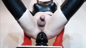 Crossdresser in spandex and high heels plays with anal plug