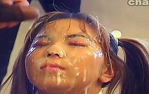 Two asian babes get a facial cum bath