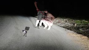On public road total naked whore on leash and high heels pissing while sucking husband′s cock