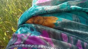 Indian MILF with big booty and boobs seduces a guy for doggy-style sex in the field