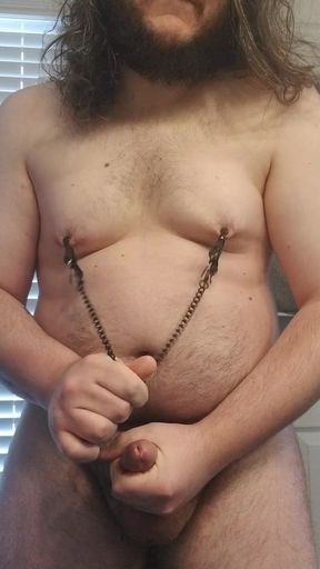 Chubby boy masturbating and playing with nipple clamps