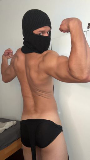Muscle hunk teasing in a tight singlet