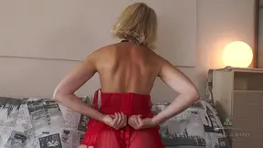 Turned on and mature Diana rubs her slick hole with a vibrator while undressing.