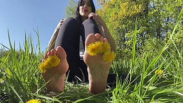 Footfetish in the park on the grass