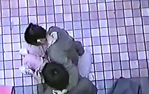 Couples flirting in the corner of a building