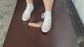 Breaking in my new Converse on my slaves condomed Cock
