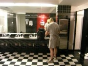 Thief changes into fully lubed rubber gear in public washroom