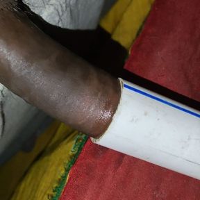 Indian boy at home having fun with conduit pipe and cumming inside it