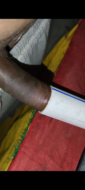 Indian boy at home having fun with conduit pipe and cumming inside it