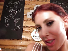 Several facial ejaculations from older, unknown men directed at a German redhead woman with very large breasts during a group sexual encounter.