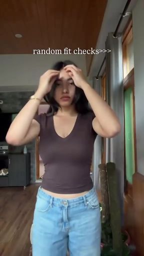 Big-titted cutie shows off her boobs