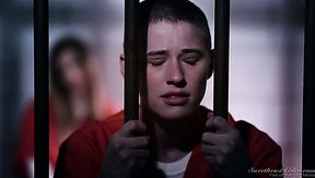 Two skinny white female convicts in the jail cell pleasure each other