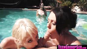 Hot girls swap dicks at poolside &mdash;  licking and penetrating each other