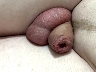 Tiny dick pissing close up