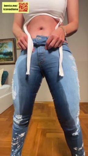 Busty MILF was so desperate to pee that she wet her jeans before pissing into a champagne glass.