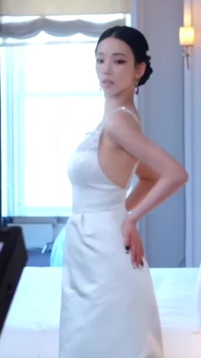 K-pop star with big tits stands confidently in a slimmer body pose