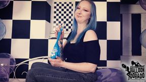 Emily is blowing a soap blue 24 Inch ballon untill it pops 4K UHD Version