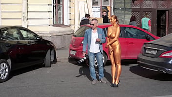 I undressed her, painted her with gold paint, and took her outside. Right in the city center...