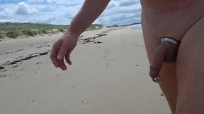 Strolling along the beach in the nude