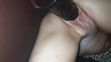 Big black dildo sinks deep into wet white pussy as moaning wife claws the bed