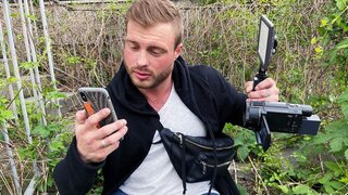 Short-haired blonde woman is having sex while outside