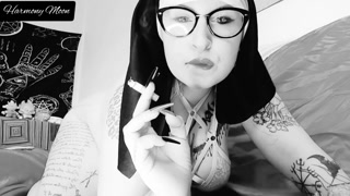Horny nun smokes a cigarette