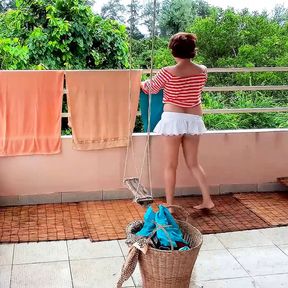 Naked laundry. The maid is drying clothes in the laundry.