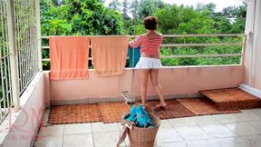 Naked laundry. The maid is drying clothes in the laundry.