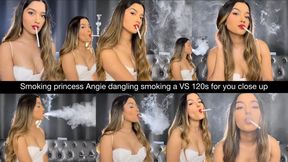 Smoking princess Angie dangling smoking a VS 120s for you close up in a lovely white dress! Nose exhales, multi pumps, side view