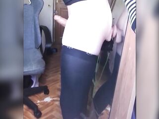 Femboy stands banging himself with a sex tool in front of the mirror.