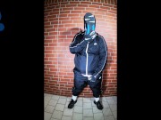 Scally Pup in shiny tracksuit pawing off and sniffing