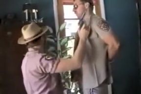 cowboy sheriff gives cop a blowjob