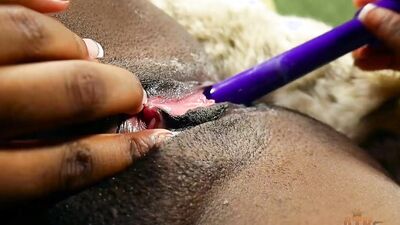 Ebony babe works her pussy into a creamy hot mess with her g-spot vibrator toy.