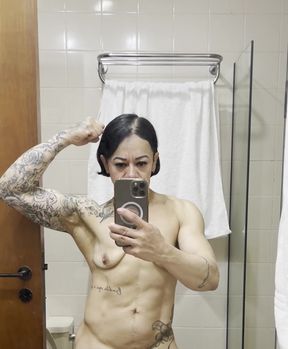 Busty MILF shows off her muscles