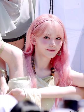 Slim k-pop fan shows off her armpits while sitting down
