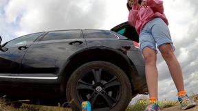 Hipster girl pee with her legs wide opened outdoor