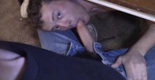 He is hiding below the table to give his partner a BJ