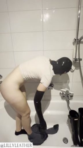 Latex teen girl pissing in jeans and rubber boots