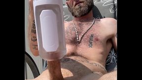 Verbal Daddy Bradley K Savage uses electric blowjob machine outside