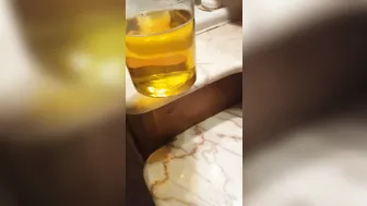 Skinny Italian twink fills a jar with golden piss
