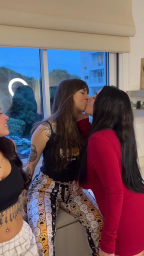 Three amateur lesbians kiss in a steamy threesome