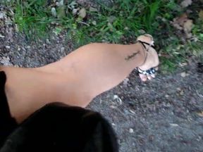 Joana V0mit Cd walking in nature, showing legs, heels, nails