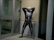 nighttime skeleton jerking off in front of outside doors