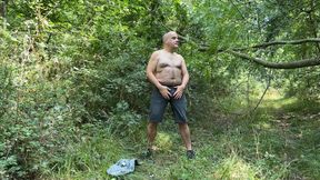 Zolee undresses in the forest and then cums